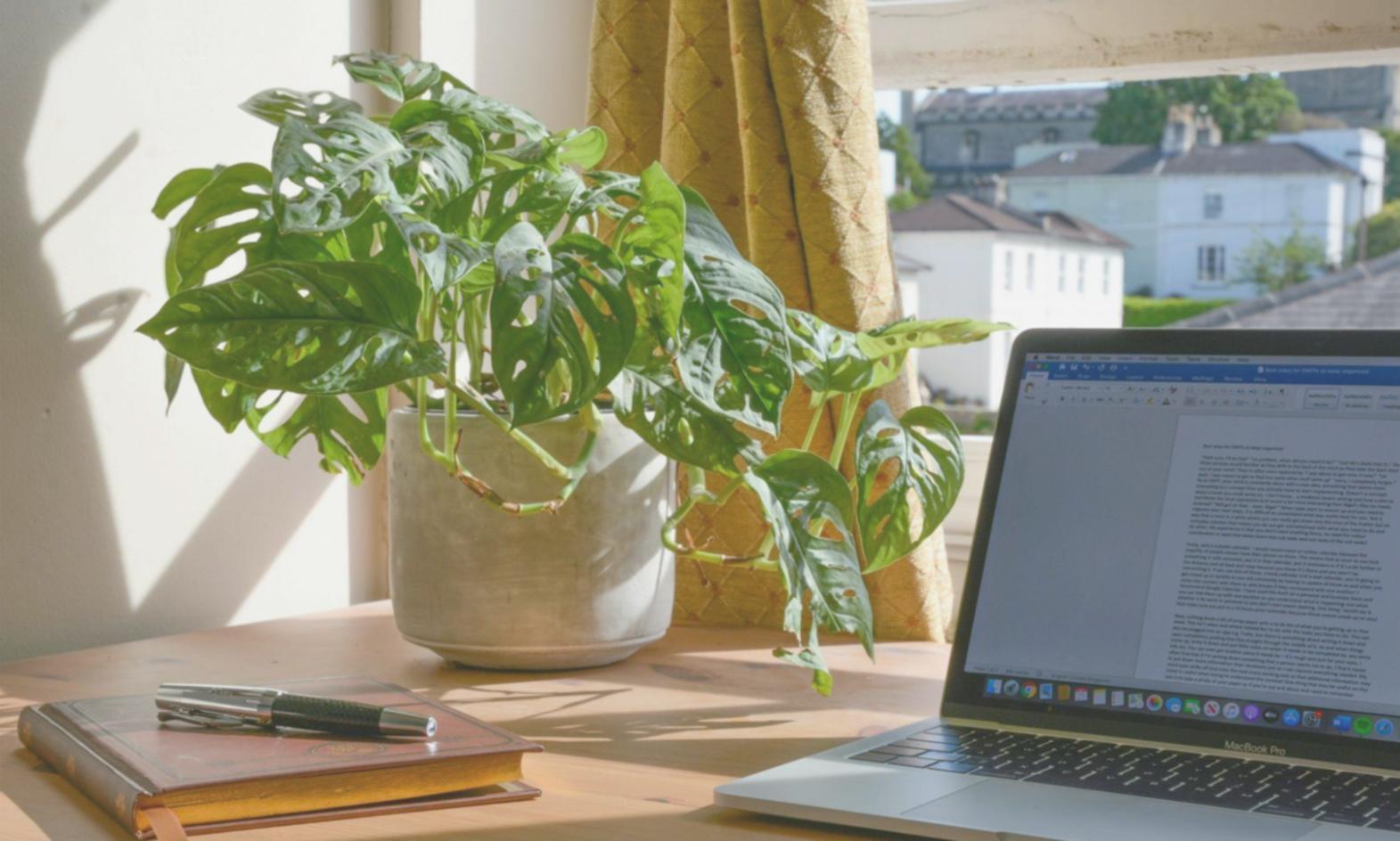 Family reviewing financial documents together around dining table