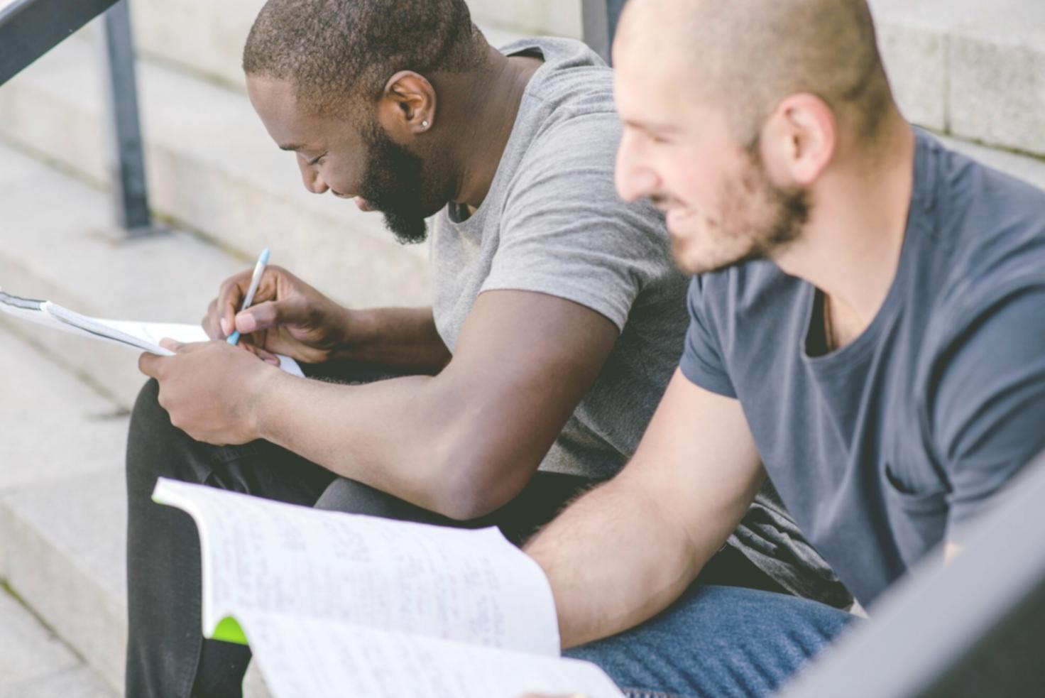 Family working together on financial planning at kitchen table with documents and calculator
